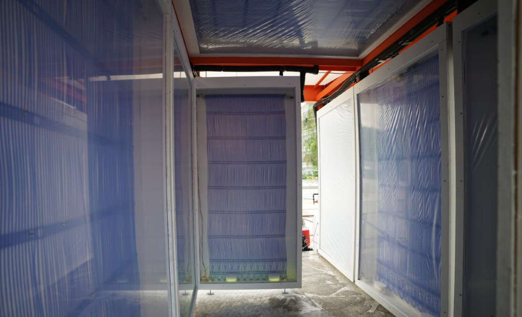 Cooling panels draw heat away from people standing nearby.