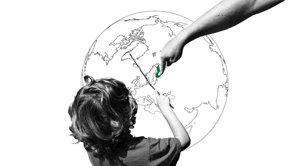 Child pointing to Finland on a world map