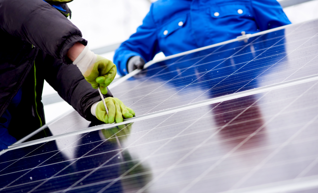 person working on solar panels