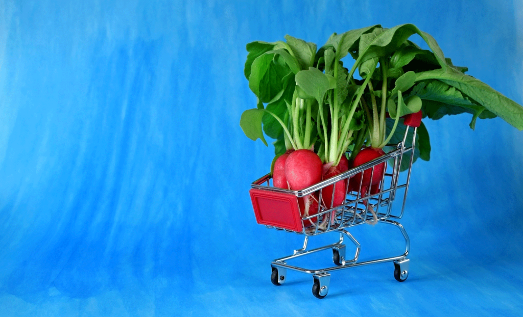 Shopping cart with radishes in it