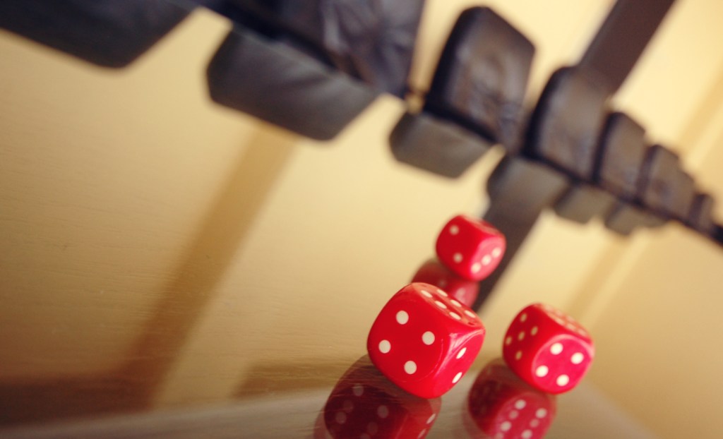 Red pair of dice at boardroom table