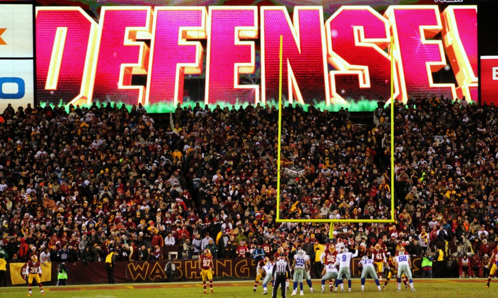 Image of football field with "Defense" in huge font