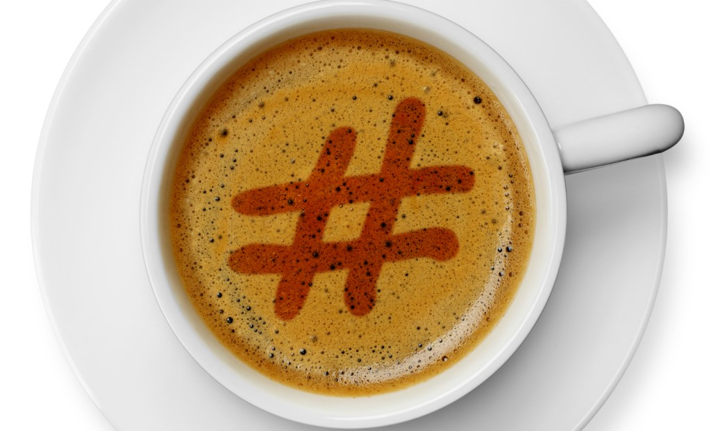 Hashtag drawn in coffee foam