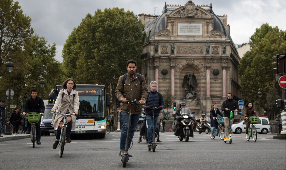 Busy mix of roadway traffic around place Saint Michel in Central Paris