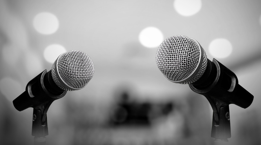 Photo of microphones set up for debate