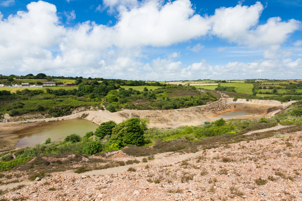 Abandoned mine and tailings dam at Wheal Maid Valley in Cornwall