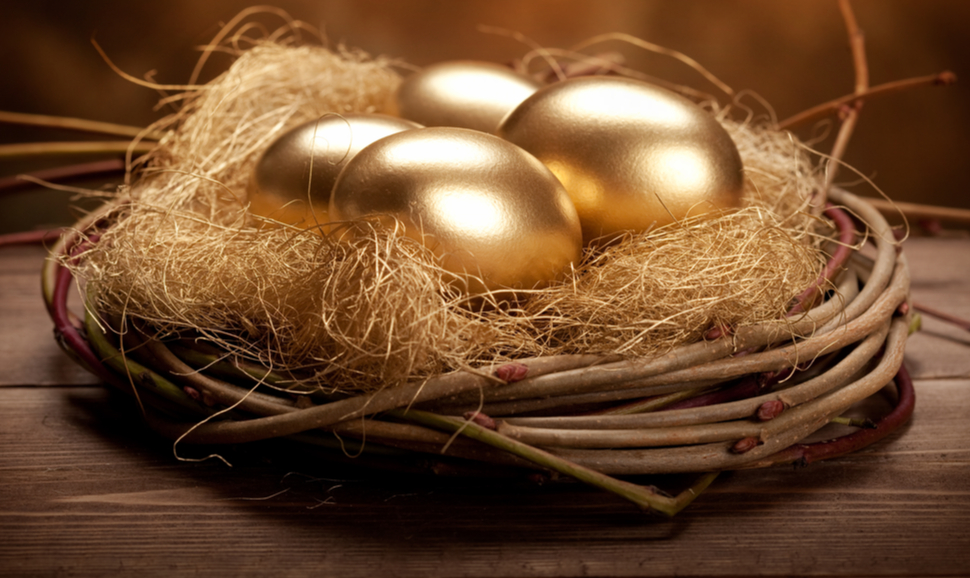 Four golden eggs in a nest