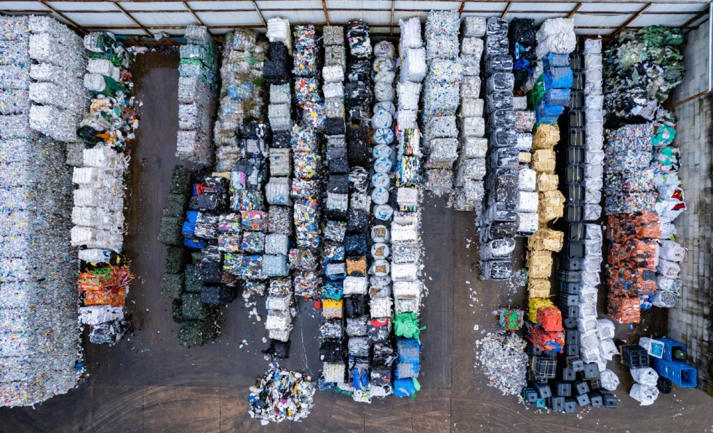 Piles of sorted plastic waste.