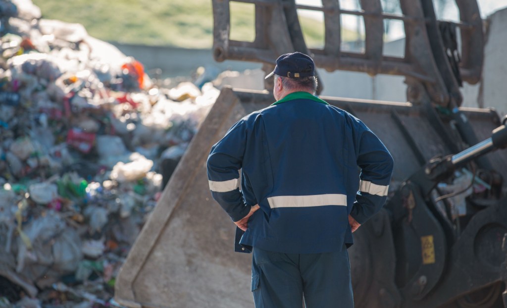 A recycling worker at an unidentified location.