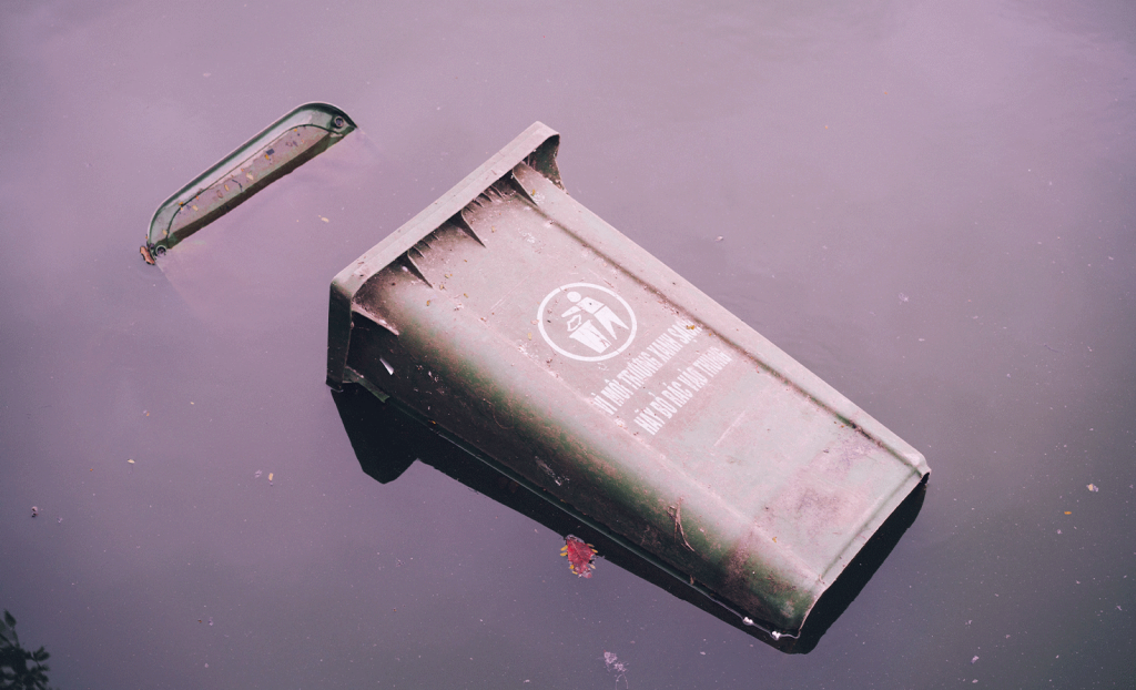 recycling can floating in flood