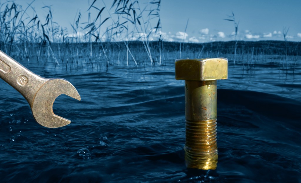 Wrench and bolt in water