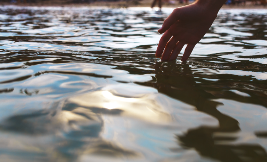 hand touching water