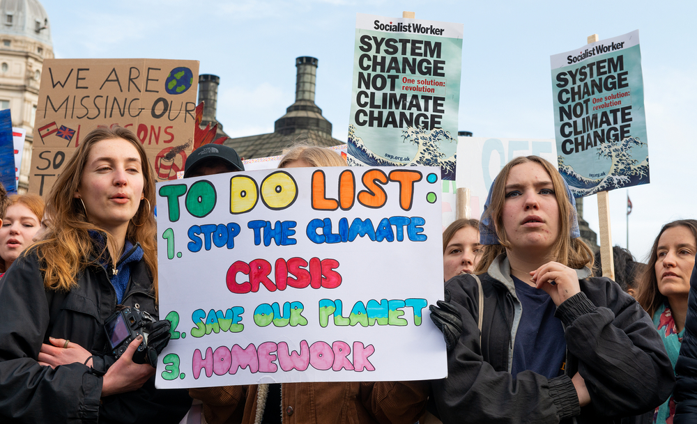 Student activists with placards at the February 2020 Youth Strike 4 Climate demonstration rally at Parliament Square