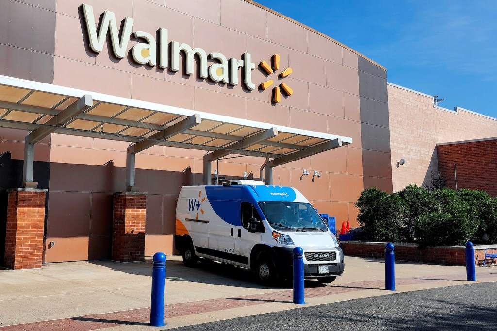 Walmart van parked in front of a store.