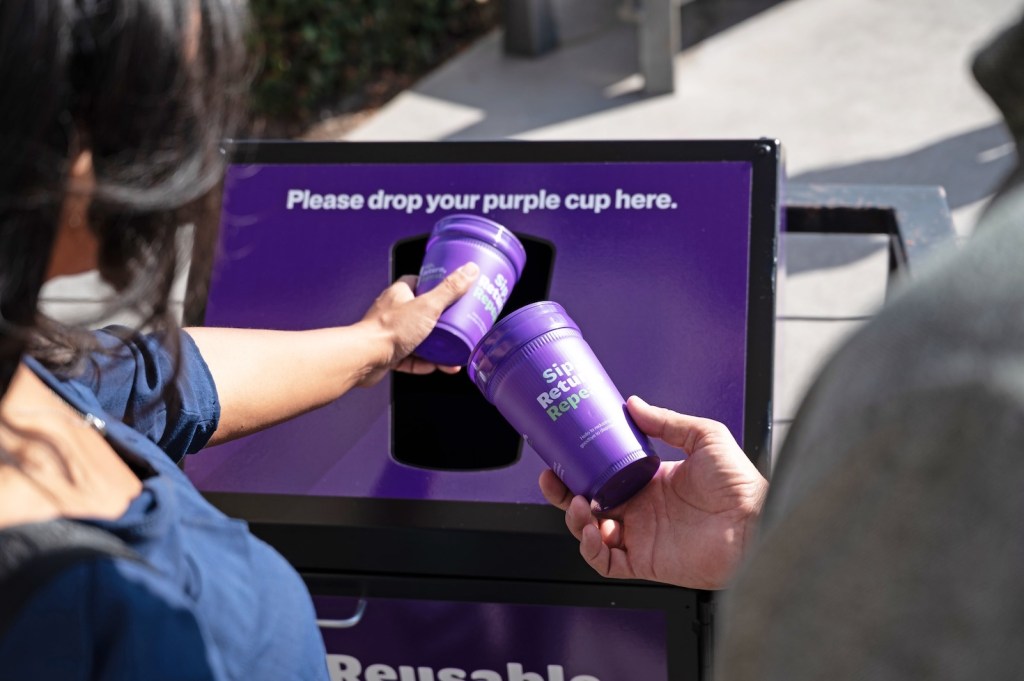 Purple bin for collecting resusable cups.