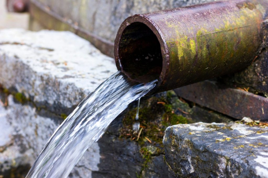 Spring water coming out of a pipe.