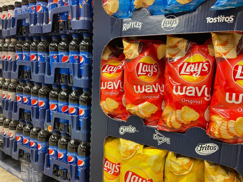 Grocery store display with Lays chips and Pepsi bottles