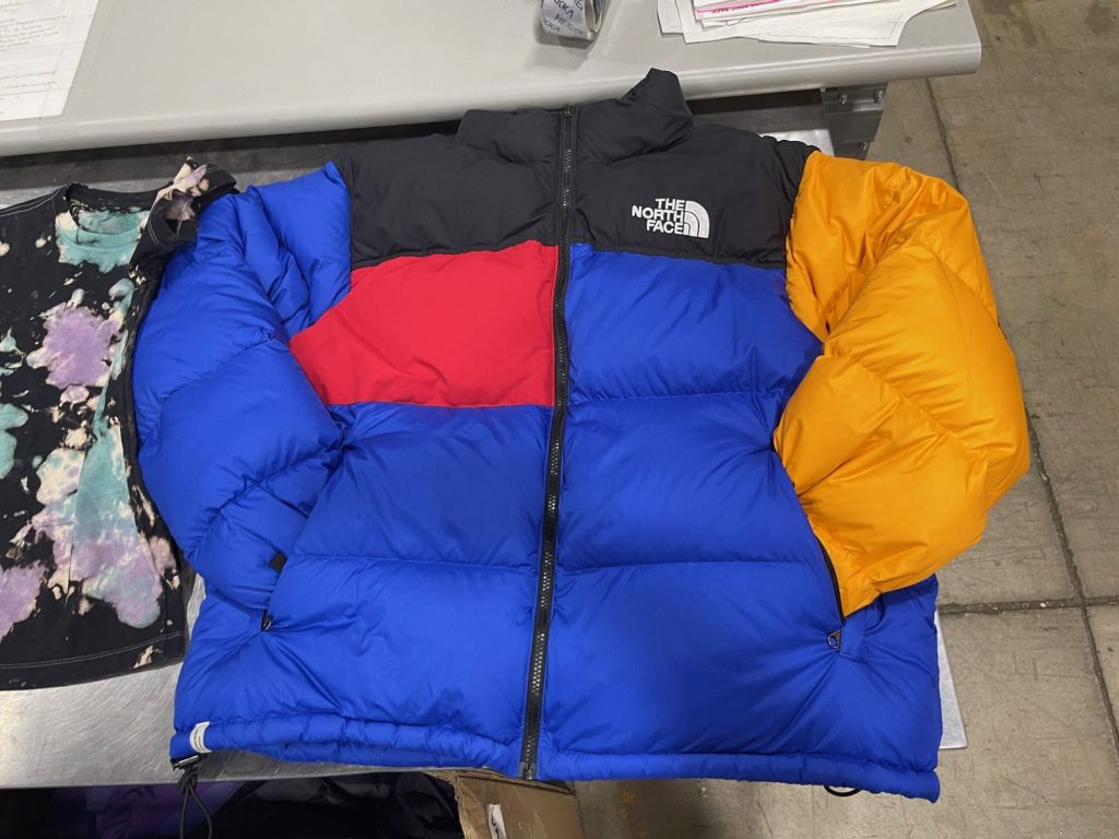 A colorful The North Face Remade jacket shows off the fact that it was refashioned from parts of secondhand jackets.