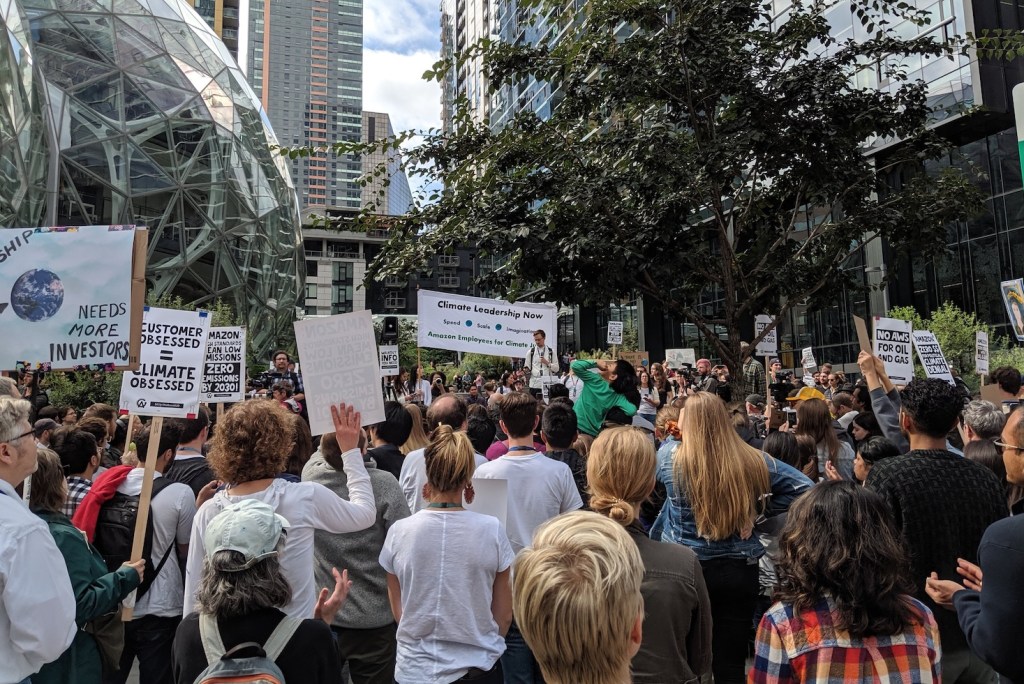 People hold signs supporting climate action