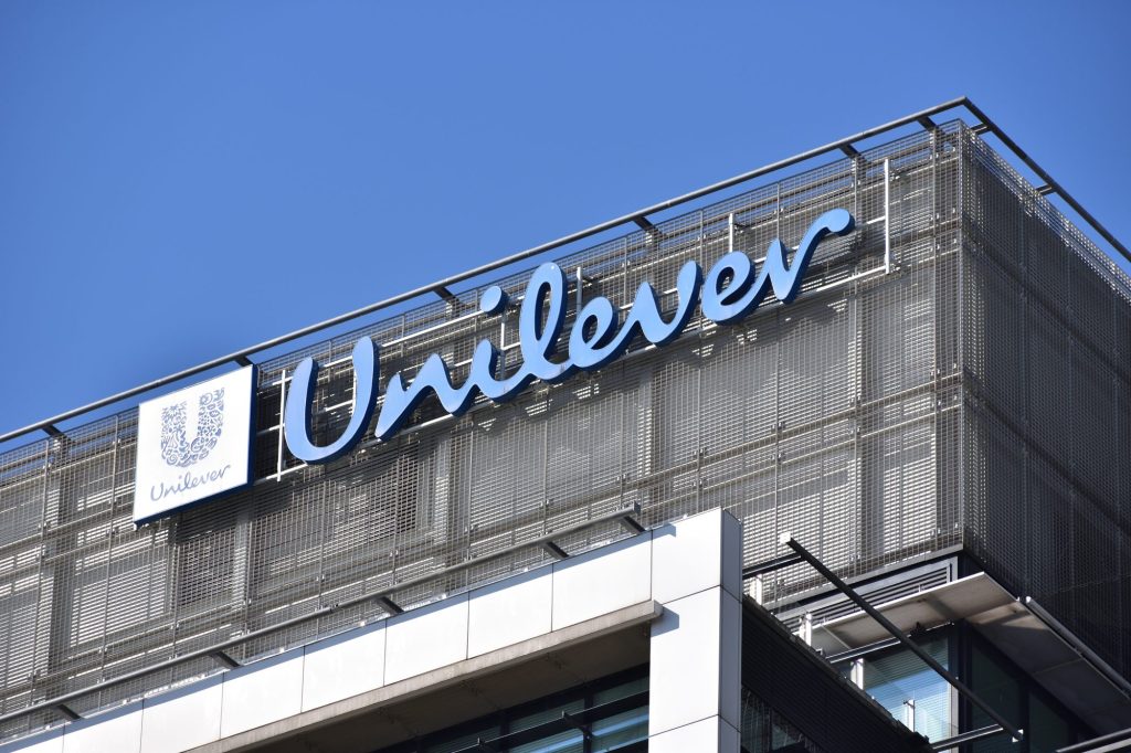 Unilever signage, logo, emblem on the facade of Anglo-Dutch multinational consumer goods and personal care company. WARSAW, POLAND - MARCH 13, 2022