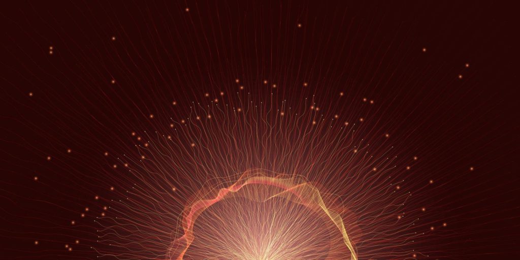 Abstract burst of energy with glowing particles.