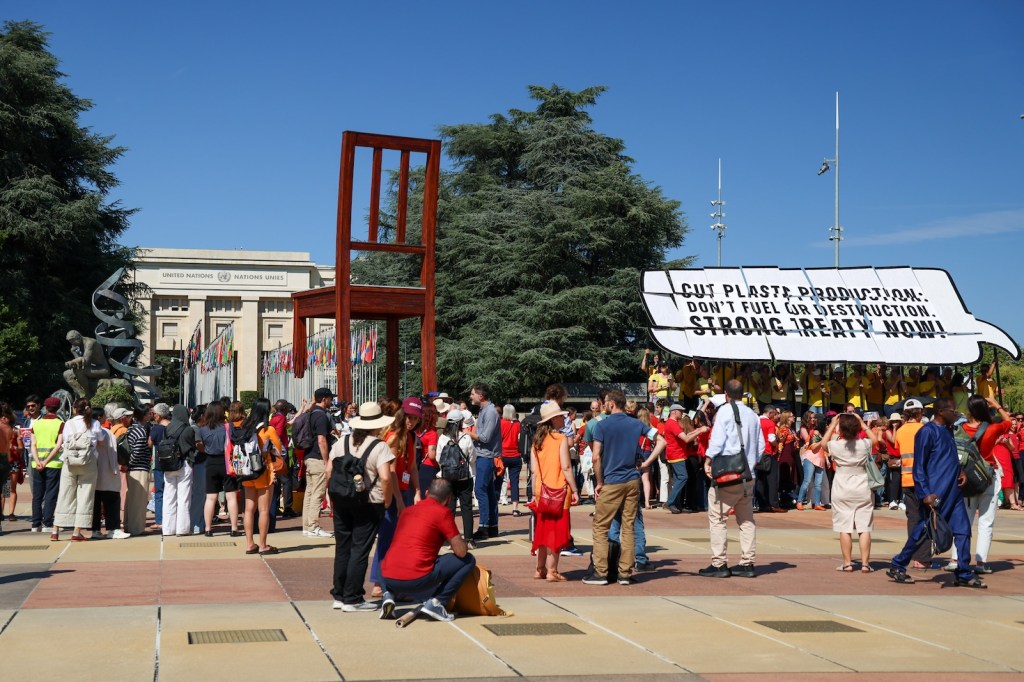 People gathered with a protest sign