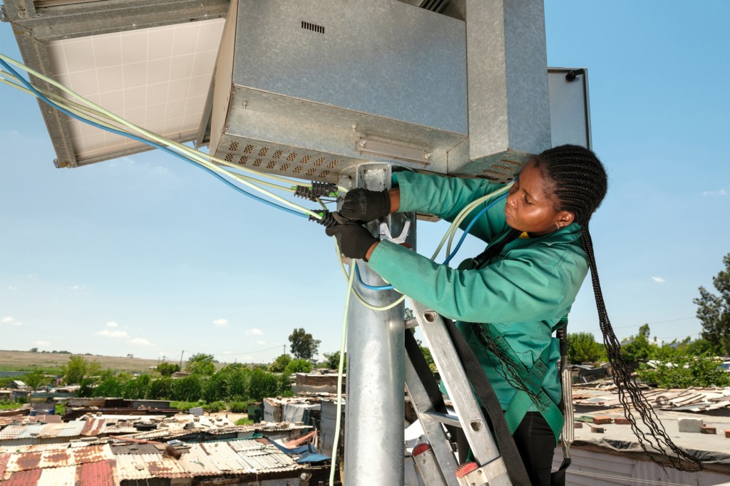 Solar power being installed in the densely populated township of Diepsloot in South Africa.