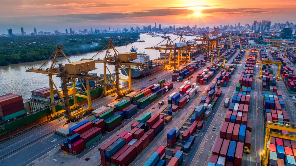 Aerial view of container port and ships.