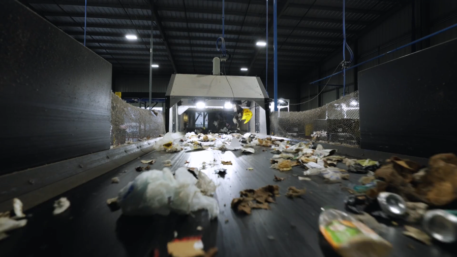 Trash on a conveyor belt at a sorting facility.