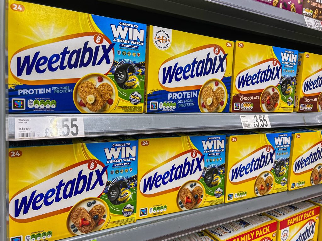 Packets of Weetabix cereal on a supermarket shelf.