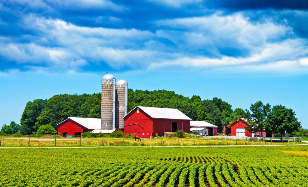 Farm buildings and fields on US farm.