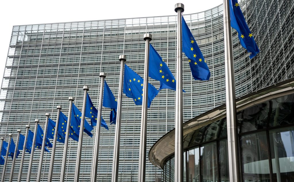 European Union Flags Waving In Brussels Opposite The European Commission Building