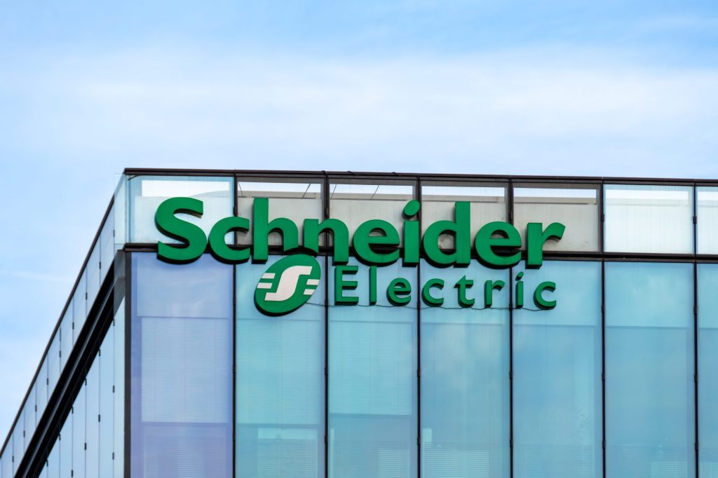 Sign and logo on the headquarters building of Schneider Electric, a French multinational company specializing in digital automation and energy management