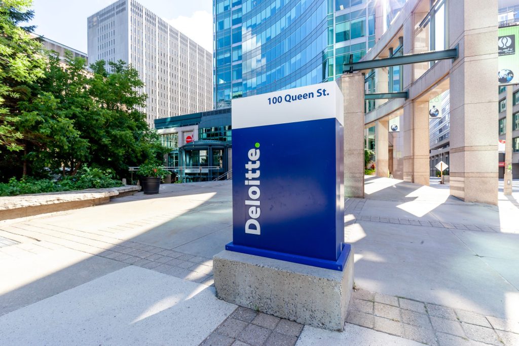 Deloitte sign outside company office.